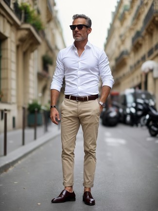 White Long Sleeve Shirt · Beige Chinos · Dark Brown Leather Derby Shoes · Dark Brown Leather Belt · Black Sunglasses · Silver Watch
