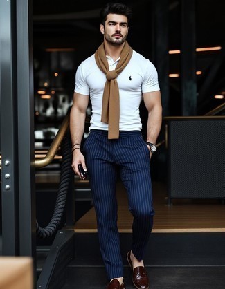 Tan Crew-neck Sweater · White Polo · Navy Vertical Striped Dress Pants · Dark Brown Leather Tassel Loafers · Black Leather Watch