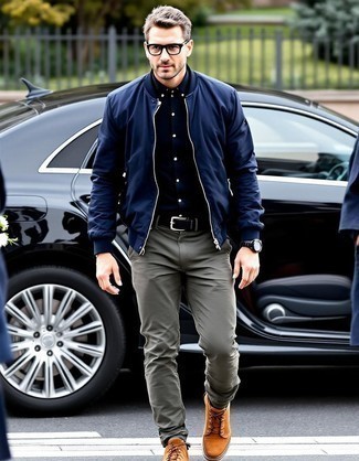 Navy Bomber Jacket · Black Long Sleeve Shirt · Olive Chinos · Brown Suede High Top Sneakers · Black Leather Belt · Dark Brown Leather Watch
