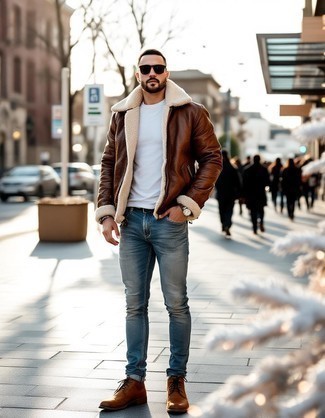 Brown Shearling Jacket · White Crew-neck Sweater · Light Blue Skinny Jeans · Brown Leather Casual Boots · Black Sunglasses · Silver Watch