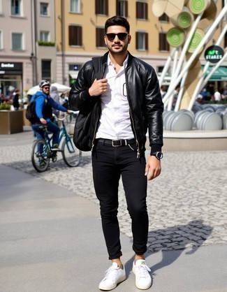 Black Leather Bomber Jacket · White Long Sleeve Shirt · Black Skinny Jeans · White Leather Low Top Sneakers · Black Backpack · Black Leather Belt