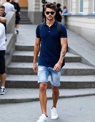 Navy Polo · Light Blue Denim Shorts · White Low Top Sneakers · Black Backpack · Black Sunglasses