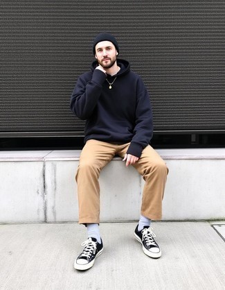 Black Hoodie · Black Crew-neck T-shirt · Khaki Chinos · Black and White Canvas Low Top Sneakers · Black Beanie · White Socks