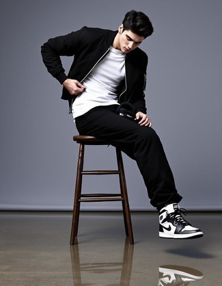 Black Bomber Jacket · White Crew-neck T-shirt · Black Crew-neck T-shirt · Black Sweatpants · White and Black Leather High Top Sneakers · Black Bucket Hat