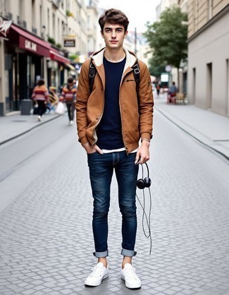 Tan Windbreaker · Black Crew-neck T-shirt · White Crew-neck T-shirt · Blue Jeans · White Canvas Low Top Sneakers · Black Canvas Backpack