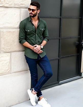 Dark Green Long Sleeve Shirt · Navy Jeans · White Leather Low Top Sneakers · Tan Sunglasses · Brown Leather Watch · Tan Beaded Bracelet