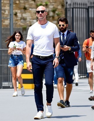 White Crew-neck T-shirt · Navy Chinos · White Leather Low Top Sneakers · Black Studded Leather Belt · Black Sunglasses · Silver Watch