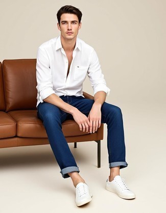 White Long Sleeve Shirt · Navy Jeans · White Leather Low Top Sneakers