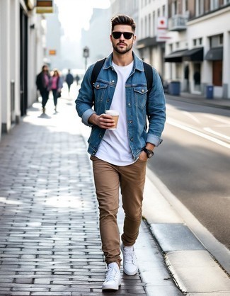 Light Blue Denim Jacket · White Crew-neck T-shirt · Khaki Chinos · White Leather Low Top Sneakers · Black Leather Backpack · Charcoal Sunglasses