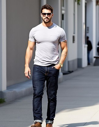 Grey Crew-neck T-shirt · Navy Jeans · Brown Leather Desert Boots · Clear Sunglasses · Gold Watch