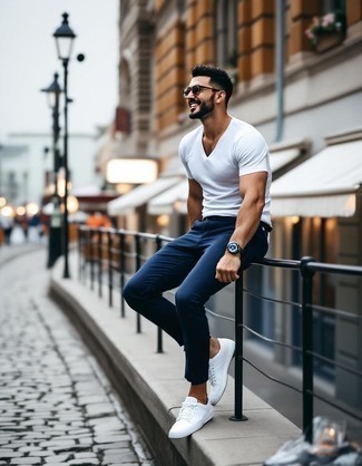 White Crew-neck T-shirt · Navy Chinos · White Canvas Low Top Sneakers · Clear Sunglasses · Dark Brown Leather Watch