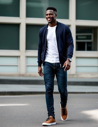 Navy Bomber Jacket · White Crew-neck T-shirt · Navy Jeans · Brown Leather Low Top Sneakers · Dark Brown Leather Watch · Navy Print Socks