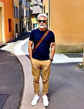 Navy Crew-neck T-shirt · Khaki Chinos · White Canvas Low Top Sneakers · Brown Canvas Messenger Bag · Dark Brown Sunglasses · Brown Leather Watch