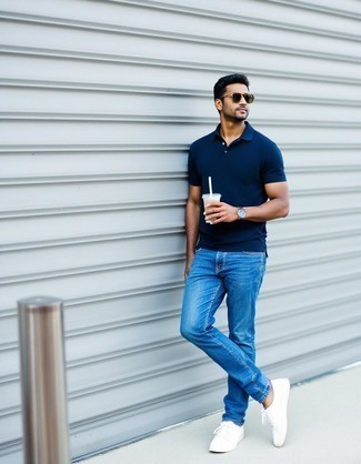 Navy Polo · Blue Jeans · White Canvas Low Top Sneakers · Dark Brown Sunglasses · Silver Watch