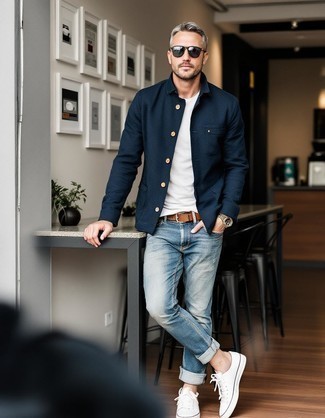 Navy Shirt Jacket · Grey Horizontal Striped Crew-neck T-shirt · Blue Ripped Jeans · White Canvas Low Top Sneakers · Brown Woven Leather Belt · Black Sunglasses