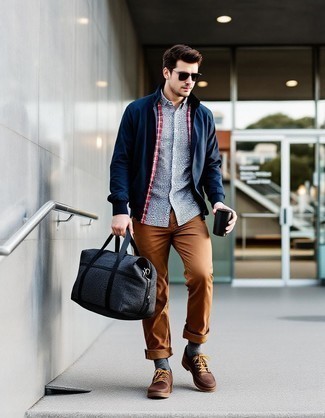 Navy Harrington Jacket · Light Blue Gingham Long Sleeve Shirt · Brown Chinos · Dark Brown Leather Low Top Sneakers · Navy Canvas Holdall · Brown Sunglasses