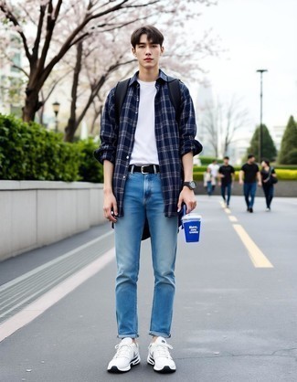 Navy and White Plaid Long Sleeve Shirt · White Crew-neck T-shirt · Light Blue Skinny Jeans · White Athletic Shoes · Navy Canvas Backpack · Black Leather Belt