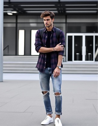 Navy Plaid Flannel Long Sleeve Shirt · Black Crew-neck T-shirt · Light Blue Ripped Skinny Jeans · White Leather Slip-on Sneakers · Black Leather Backpack · Silver Watch