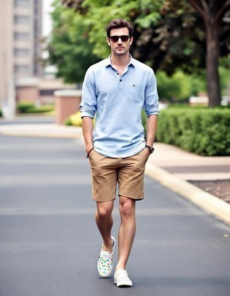 Light Blue Linen Long Sleeve Shirt · Tan Shorts · Multi colored Print Canvas Low Top Sneakers · Dark Brown Sunglasses · Gold Watch · Dark Brown Beaded Bracelet