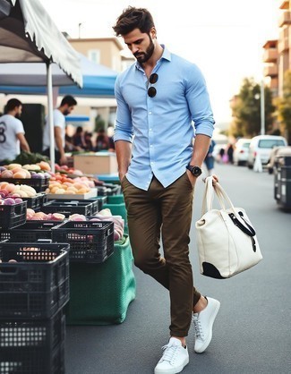 Light Blue Long Sleeve Shirt · Olive Chinos · Beige Canvas Low Top Sneakers · Beige Canvas Duffle Bag · Black Sunglasses · Black Leather Watch