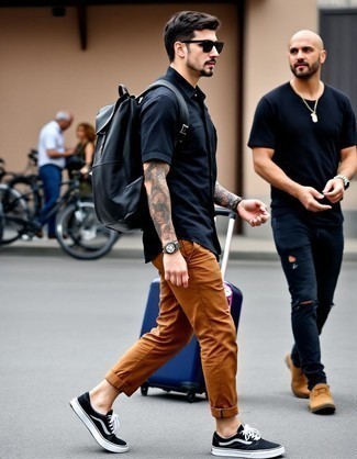 Navy Short Sleeve Shirt · Tobacco Chinos · Black and White Canvas Low Top Sneakers · Navy Leather Backpack · Black Sunglasses · Gold Watch