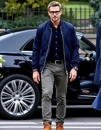 Navy Bomber Jacket · Black Long Sleeve Shirt · Olive Chinos · Brown Suede High Top Sneakers · Black Leather Belt · Dark Brown Leather Watch