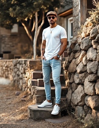 White Crew-neck T-shirt · Light Blue Skinny Jeans · White Low Top Sneakers · Tan Baseball Cap · Dark Brown Sunglasses · Silver Watch
