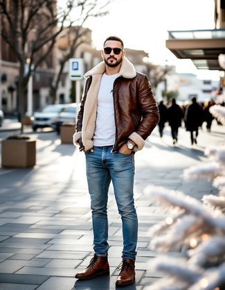 Brown Shearling Jacket · White Crew-neck Sweater · Light Blue Skinny Jeans · Brown Leather Casual Boots · Black Sunglasses · Silver Watch