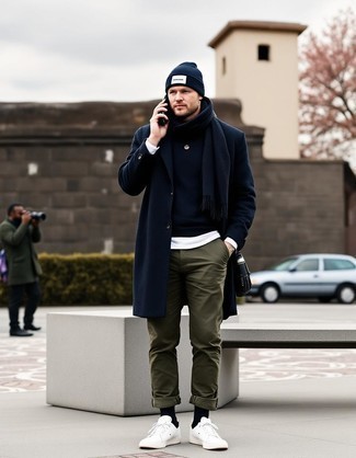 Black Overcoat · Black Crew-neck Sweater · White Crew-neck T-shirt · Olive Chinos · White Low Top Sneakers · Navy and White Beanie