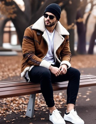 Brown Shearling Jacket · White Crew-neck T-shirt · Black Skinny Jeans · White and Black Leather Low Top Sneakers · Black Beanie · Black Sunglasses