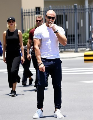 White Crew-neck T-shirt · Black Skinny Jeans · White Low Top Sneakers · Black Sunglasses · Silver Watch · Black Beaded Bracelet