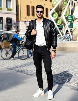 Black Leather Bomber Jacket · White Long Sleeve Shirt · Black Skinny Jeans · White Leather Low Top Sneakers · Black Backpack · Black Leather Belt