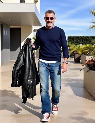 Black Leather Biker Jacket · Navy Crew-neck Sweater · White Crew-neck T-shirt · Blue Jeans · Red and White Canvas Low Top Sneakers · Dark Brown Sunglasses