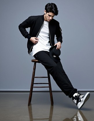 Black Bomber Jacket · Black Crew-neck T-shirt · White Crew-neck T-shirt · Black Sweatpants · White and Black Leather High Top Sneakers · Black Bucket Hat