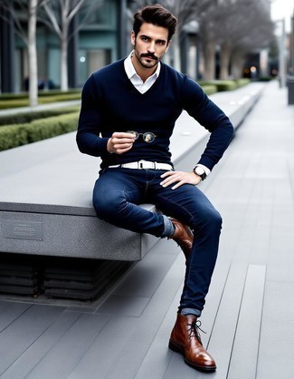 Navy V-neck Sweater · White Long Sleeve Shirt · Navy Skinny Jeans · Brown Leather Desert Boots · Black Sunglasses · Black Leather Watch