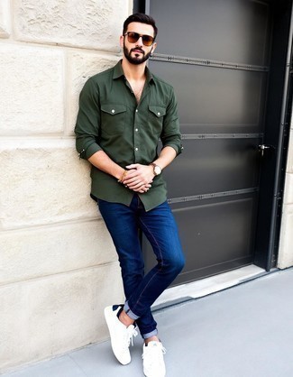 Dark Green Long Sleeve Shirt · Navy Jeans · White Leather Low Top Sneakers · Tan Sunglasses · Brown Leather Watch · Tan Beaded Bracelet