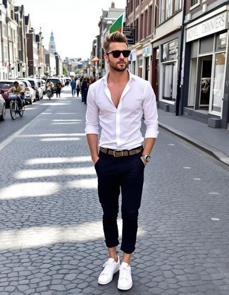 White Long Sleeve Shirt · Black Chinos · White Leather Low Top Sneakers · Brown Woven Leather Belt · Black Sunglasses · Silver Watch