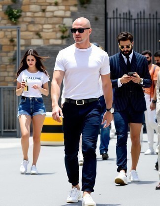 White Crew-neck T-shirt · Navy Chinos · White Leather Low Top Sneakers · Black Studded Leather Belt · Black Sunglasses · Silver Watch