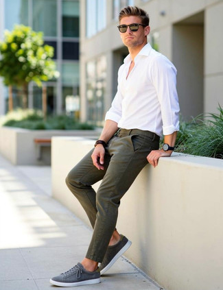 White Long Sleeve Shirt · Olive Chinos · Grey Suede Low Top Sneakers · Black Sunglasses · Navy Leather Watch · Dark Brown Leather Bracelet