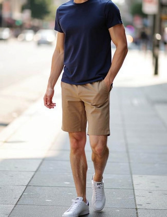 Navy Crew-neck T-shirt · Tan Shorts · White and Black Leather Low Top Sneakers