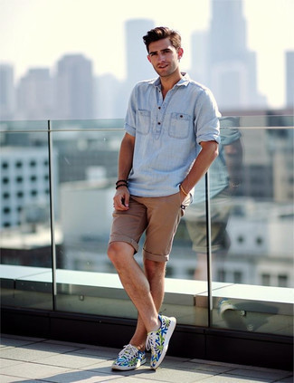 Light Blue Linen Long Sleeve Shirt · Tan Shorts · Multi colored Print Canvas Low Top Sneakers · Dark Brown Sunglasses · Gold Watch · Dark Brown Beaded Bracelet