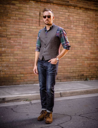 Brown Waistcoat · Dark Green Plaid Long Sleeve Shirt · Navy Jeans · Brown Suede Casual Boots · Dark Brown Leather Belt · Dark Brown Sunglasses