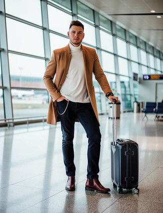 Camel Overcoat · White Turtleneck · Navy Jeans · Burgundy Leather Chelsea Boots · Navy Suitcase · Black Watch