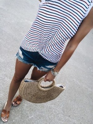 White Horizontal Striped Tank · Blue Ripped Denim Shorts · Brown Leather Flat Sandals · Tan Straw Tote Bag · Silver Watch