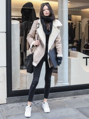 Beige Shearling Jacket · Black Crew-neck Sweater · Black Skinny Jeans · White Leather Low Top Sneakers · Black Leather Crossbody Bag · Black Leather Gloves