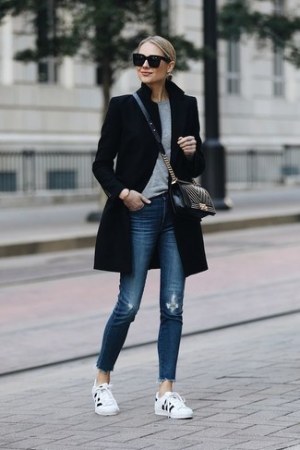 Black Coat · Grey Crew-neck Sweater · Blue Ripped Skinny Jeans · White and Black Low Top Sneakers · Black Quilted Leather Crossbody Bag · Black Sunglasses