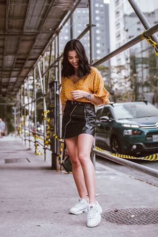 Mustard Polka Dot Short Sleeve Blouse · Black Leather Mini Skirt · White Athletic Shoes · Black Leather Satchel Bag · Silver Watch
