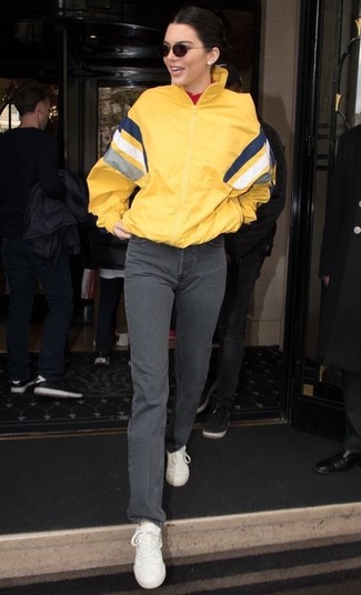 Yellow Windbreaker · Red Turtleneck · Grey Jeans · White Leather Low Top Sneakers · Black Sunglasses
