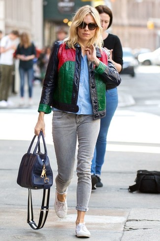 Multi colored Leather Shirt Jacket · Light Blue Short Sleeve Button Down Shirt · Grey Jeans · White Canvas Low Top Sneakers · Navy Leather Tote Bag