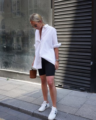 White Dress Shirt · Black Bike Shorts · White Leather Low Top Sneakers · Brown Leather Bucket Bag · Black and Gold Sunglasses · Silver Watch